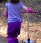child on scooter