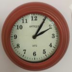 Red clock with hands